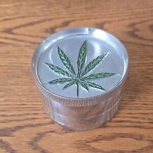 Silver Herb Grinder with Green Leaf Design